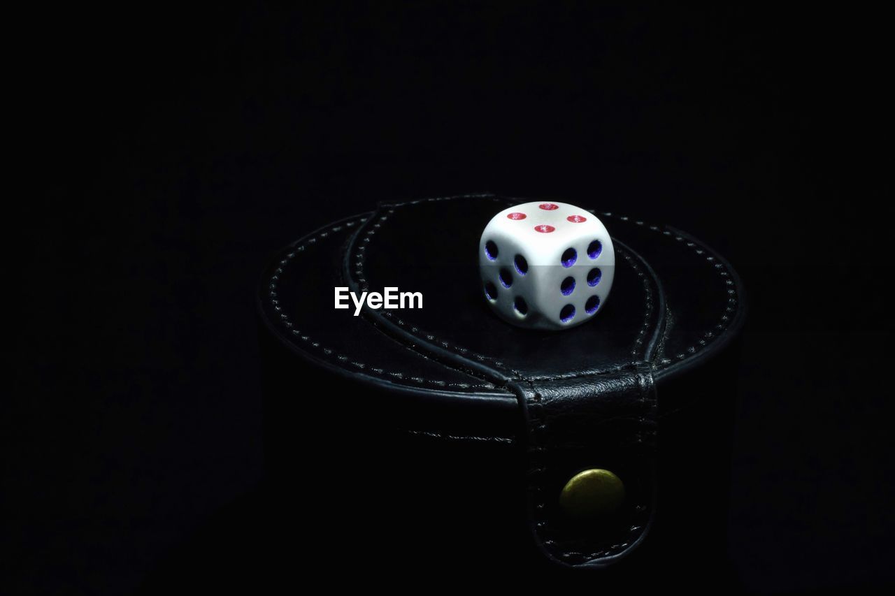 Close-up of dice against black background