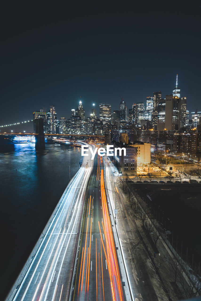 High angle view of light trails on road at night