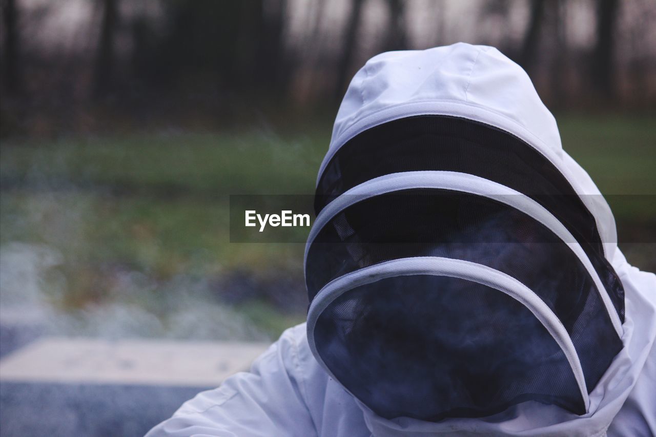 Close-up of beekeeper wearing costume