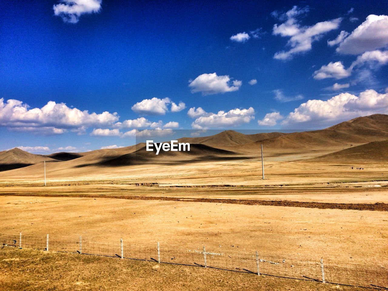 Scenic view of landscape and mountains against sky