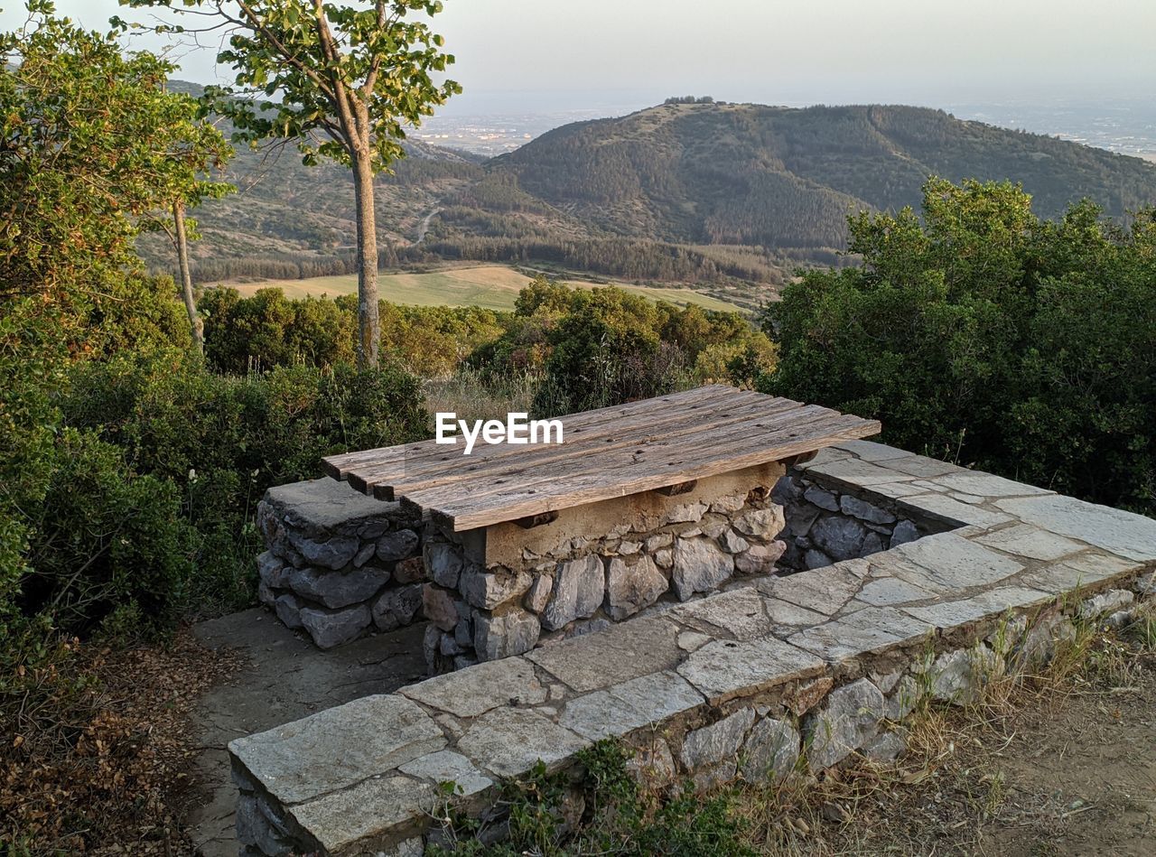 Built structure in forest against sky