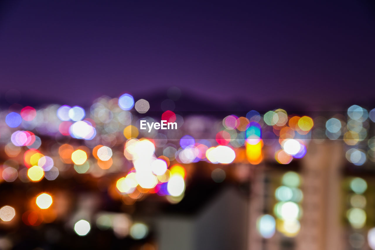 Colorful defocused lights in city at night