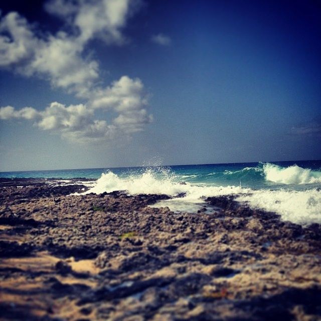 WAVES SPLASHING ON ROCKS AT SHORE