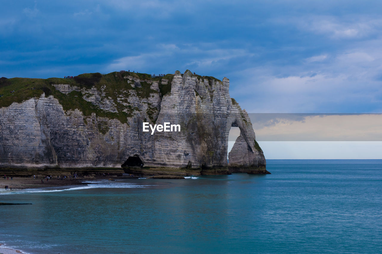 Scenic view of sea against cloudy sky