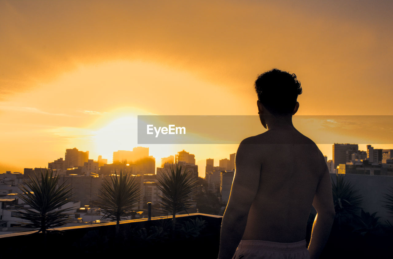 Silhouette of man against sunset in lima