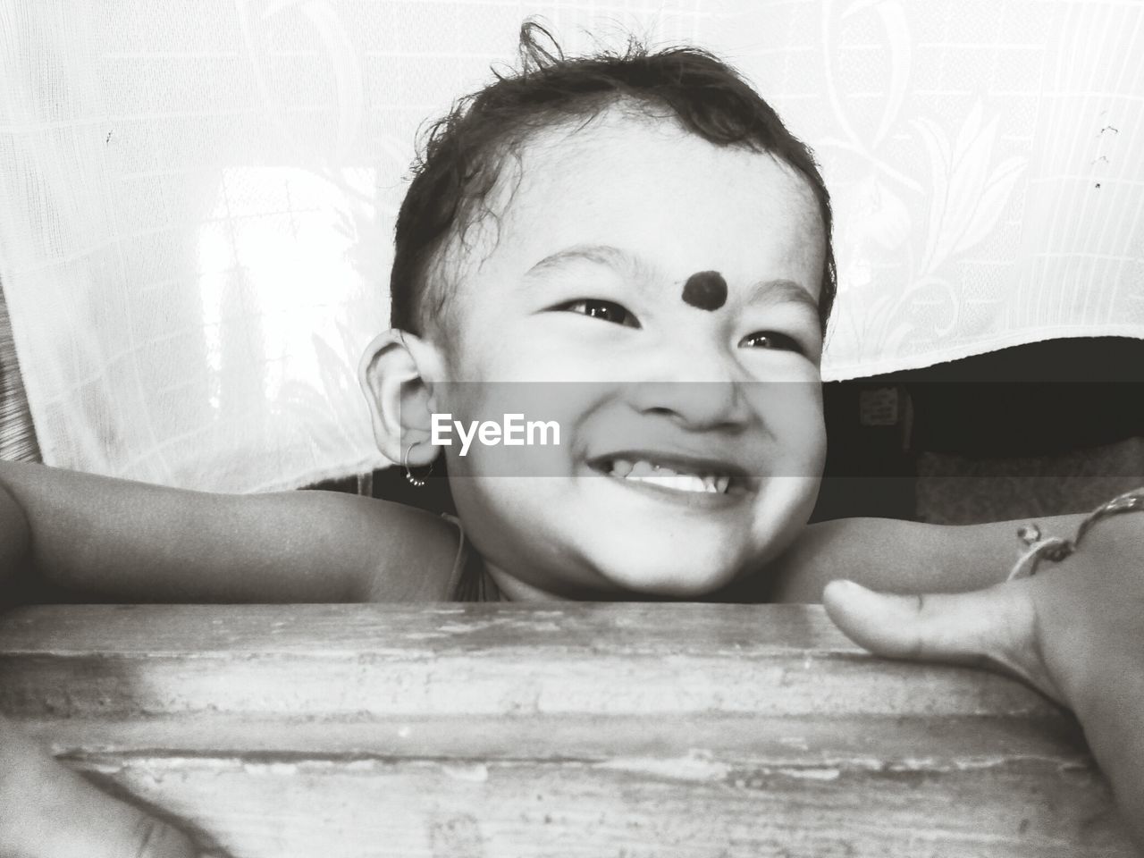 CLOSE-UP PORTRAIT OF HAPPY BOY WITH BABY