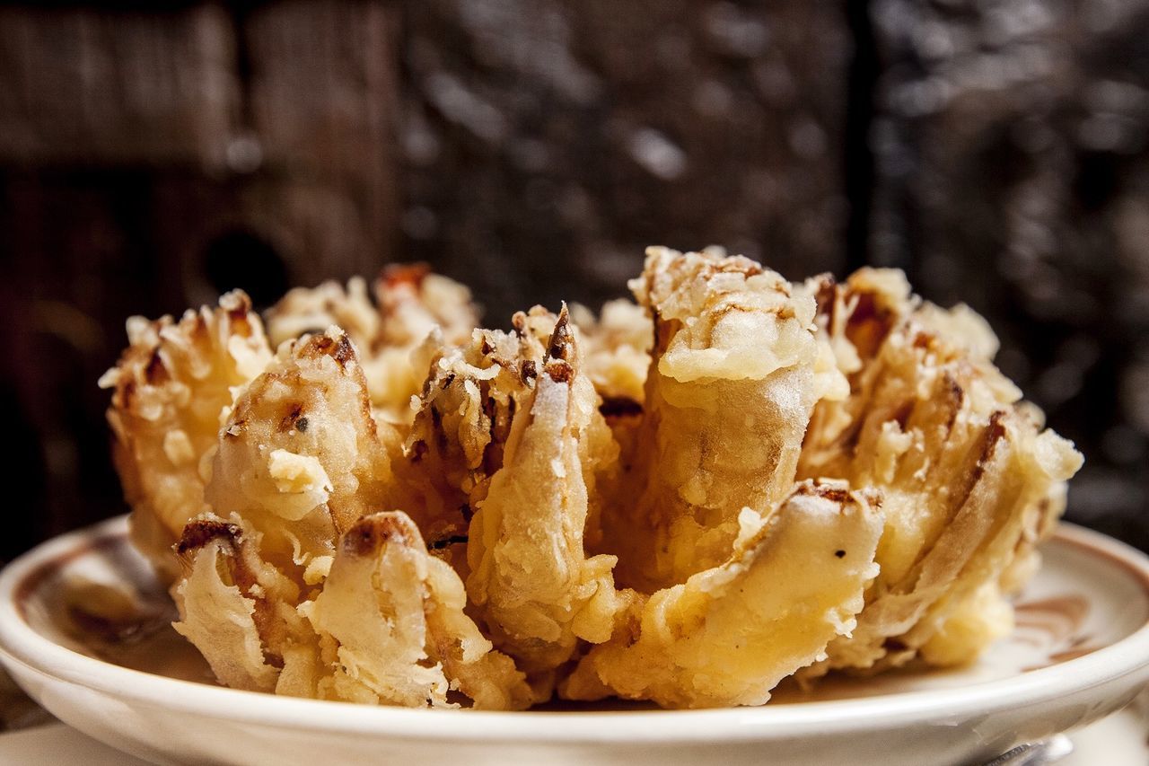 Close-up of fried onions served in plate