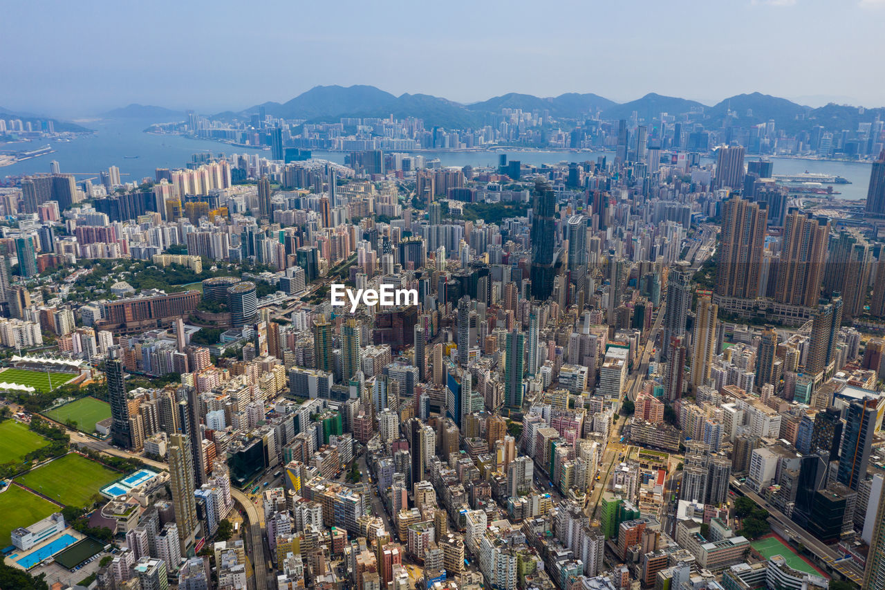 High angle view of modern buildings in city against sky