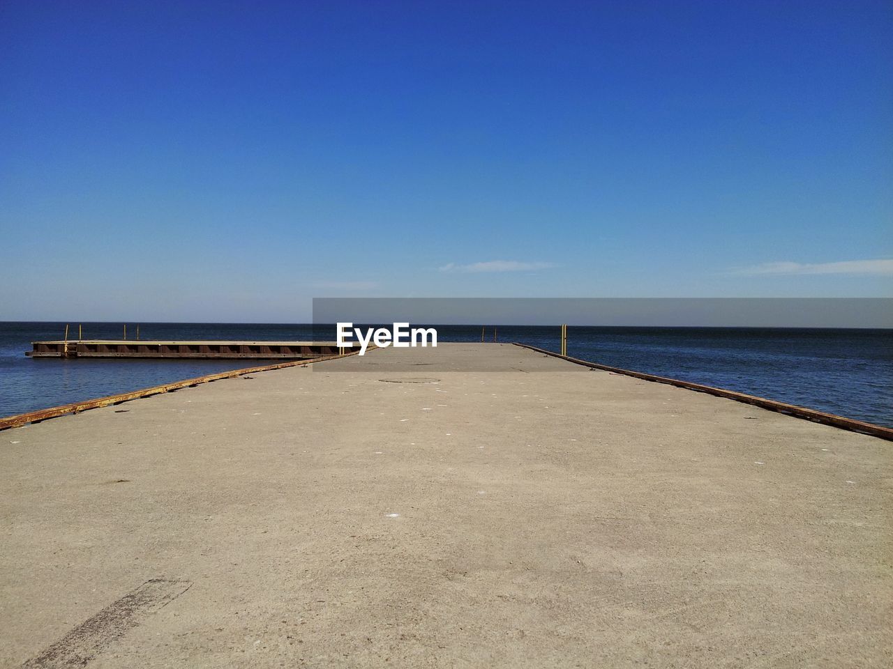 Pier over sea against sky