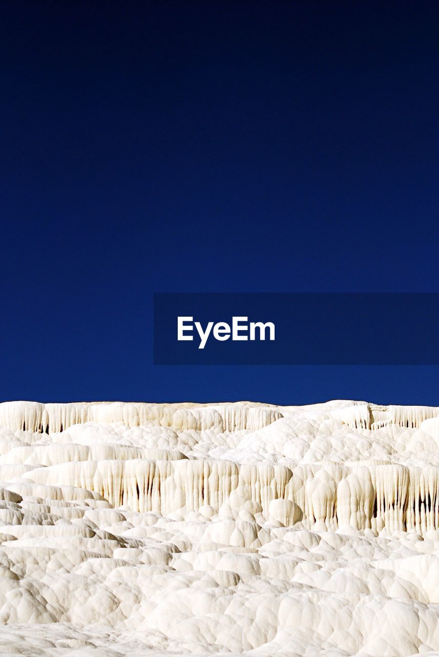 Scenic view of pamukkale against clear sky
