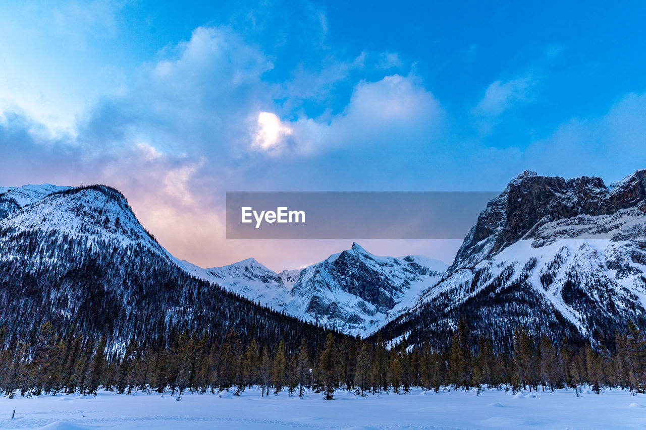 Winter wilderness sunset hiking in the snowy canadian rockies.