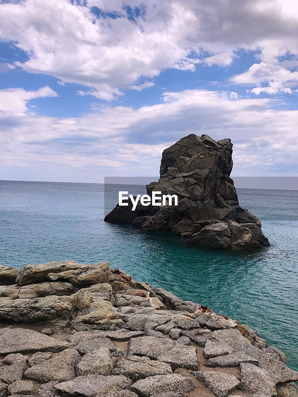 SCENIC VIEW OF ROCK FORMATION ON SEA AGAINST SKY