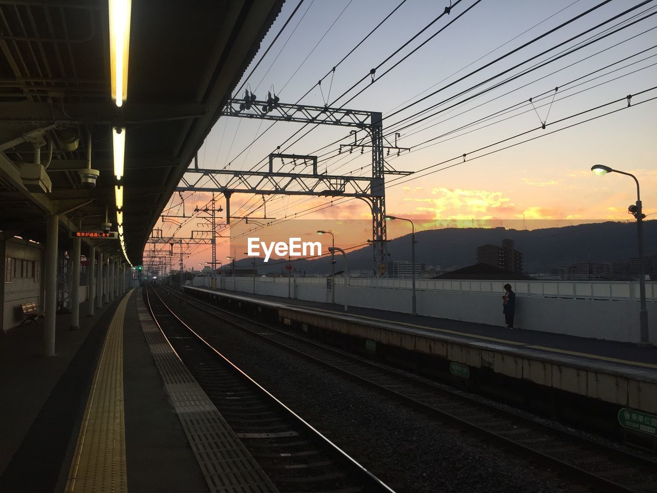 RAILROAD TRACKS AT SUNSET