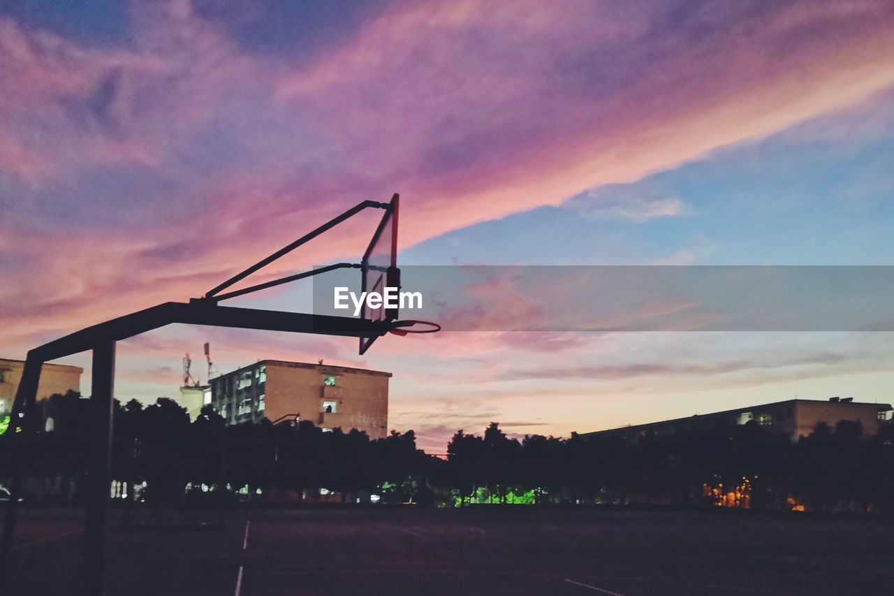 SILHOUETTE OF BUILDING AT SUNSET