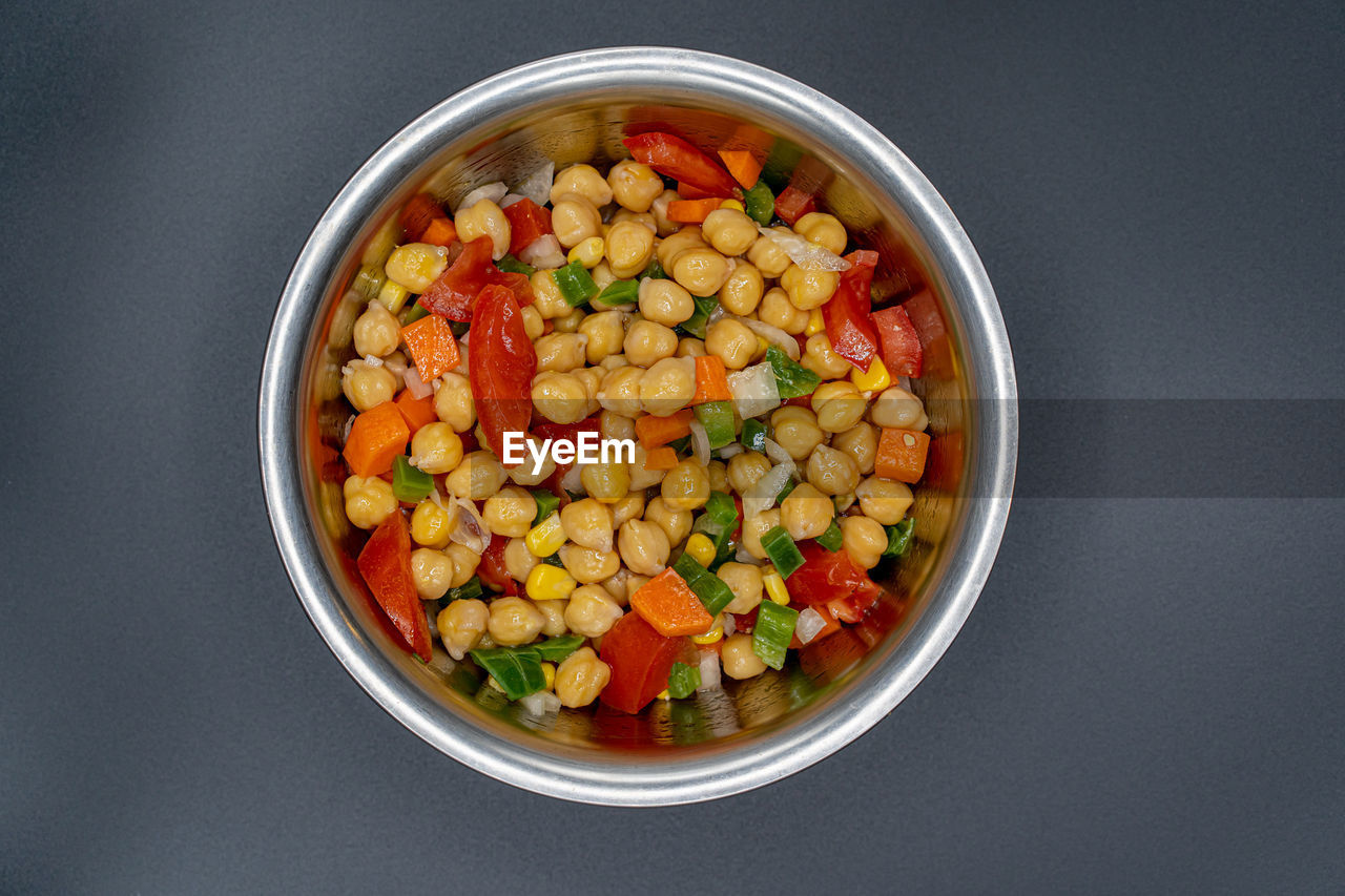 HIGH ANGLE VIEW OF FRUITS IN BOWL AGAINST BLACK BACKGROUND