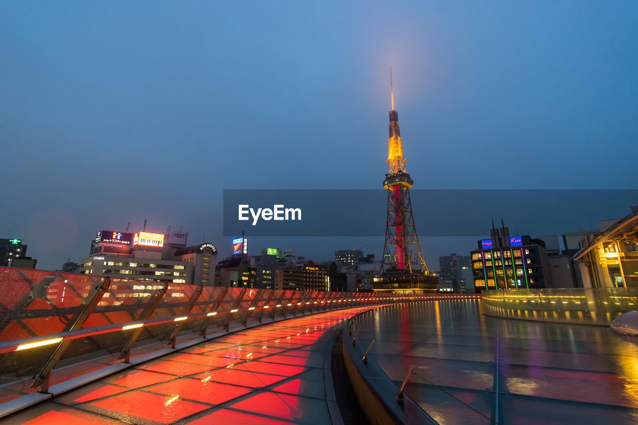 ILLUMINATED BUILDINGS AGAINST SKY AT NIGHT IN CITY