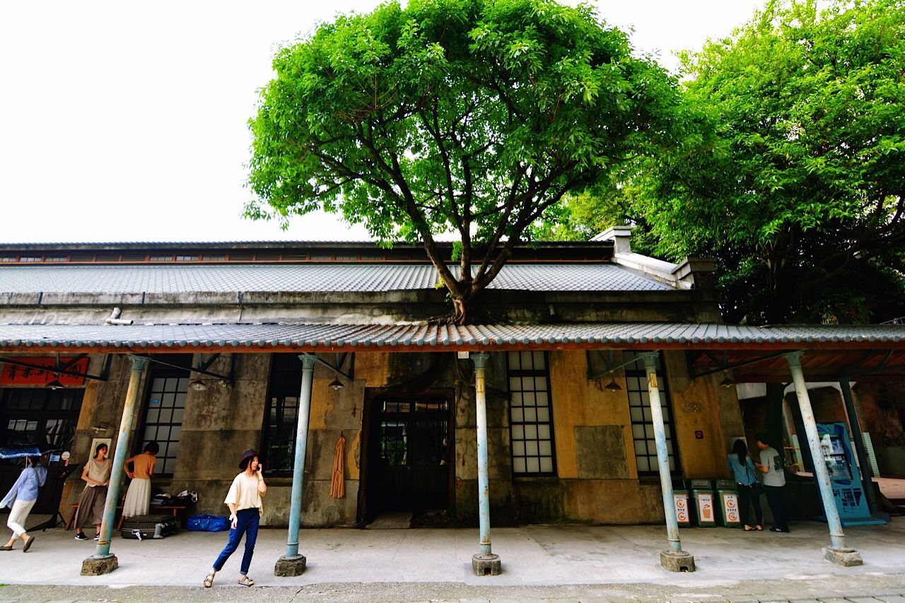 WOMAN WALKING ON BUILDING