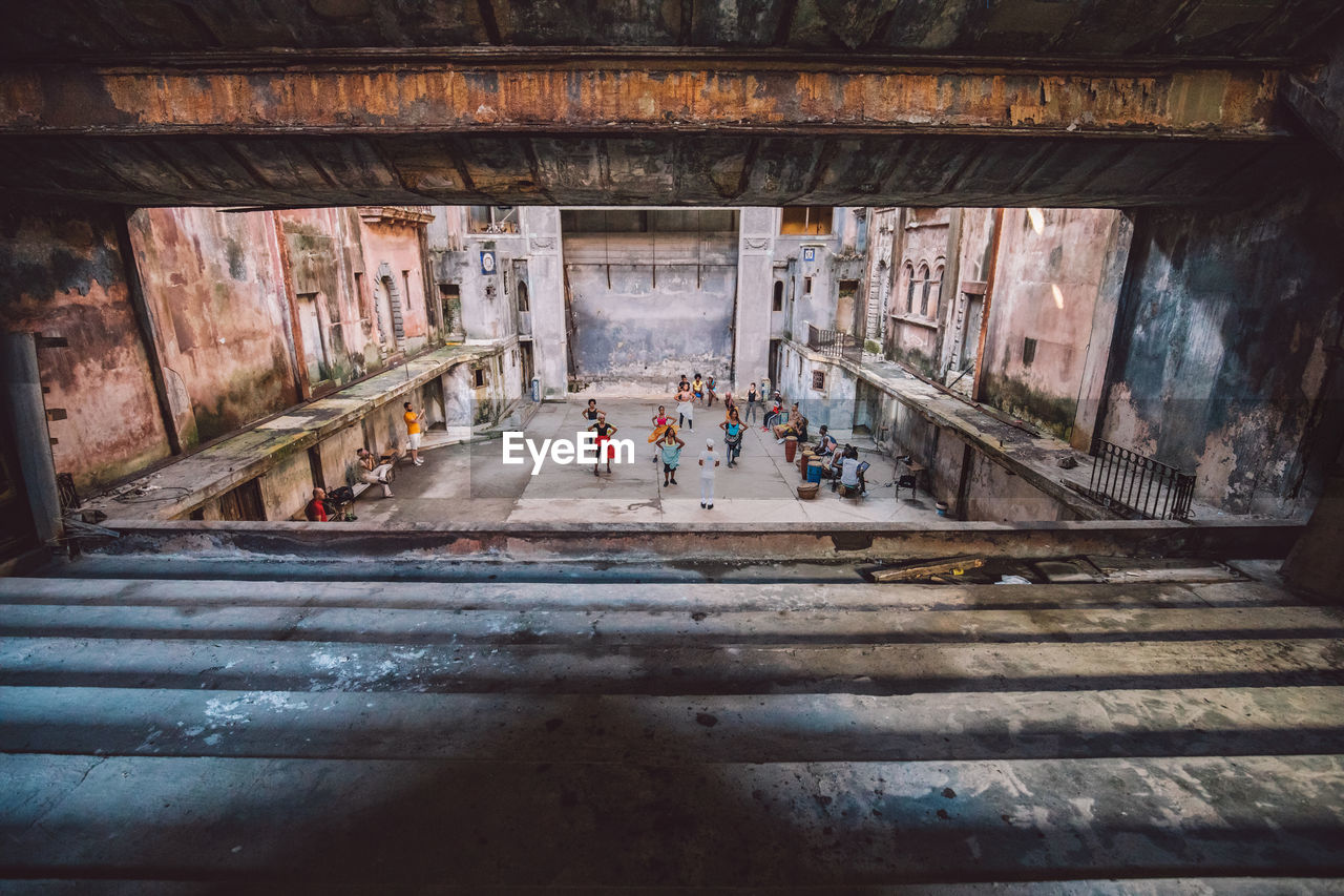 High angle view of people on stage in building