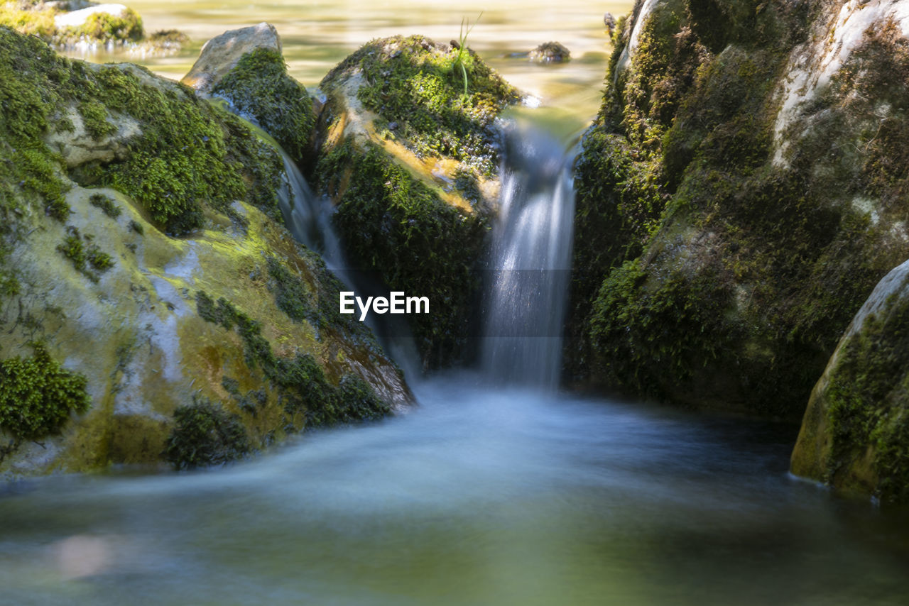 SCENIC VIEW OF WATERFALL
