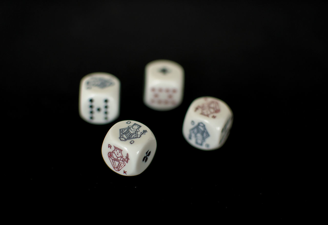 Close-up of dices on black background