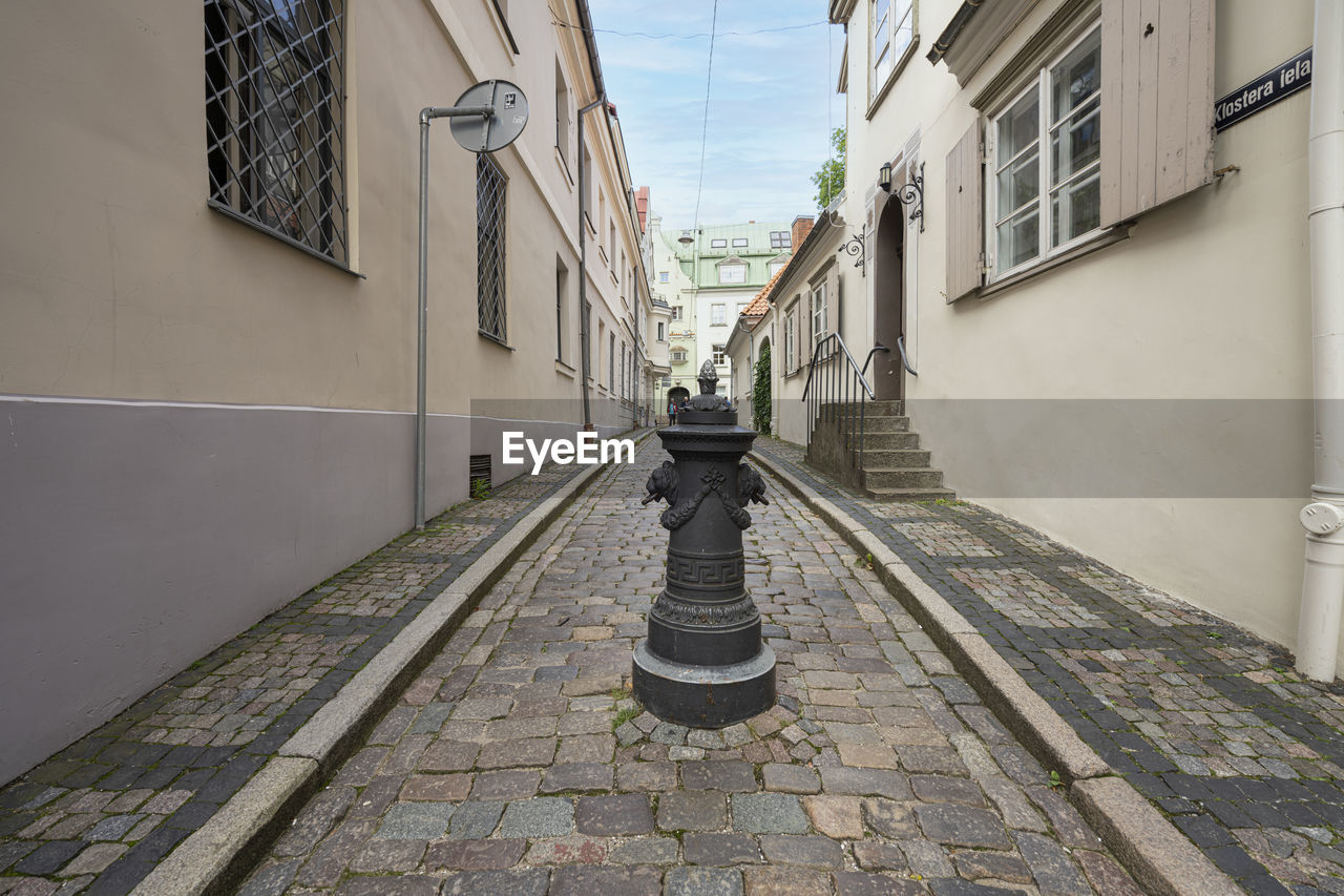 Riga, latvia. august 2021. an alley between the old houses of the historic city center