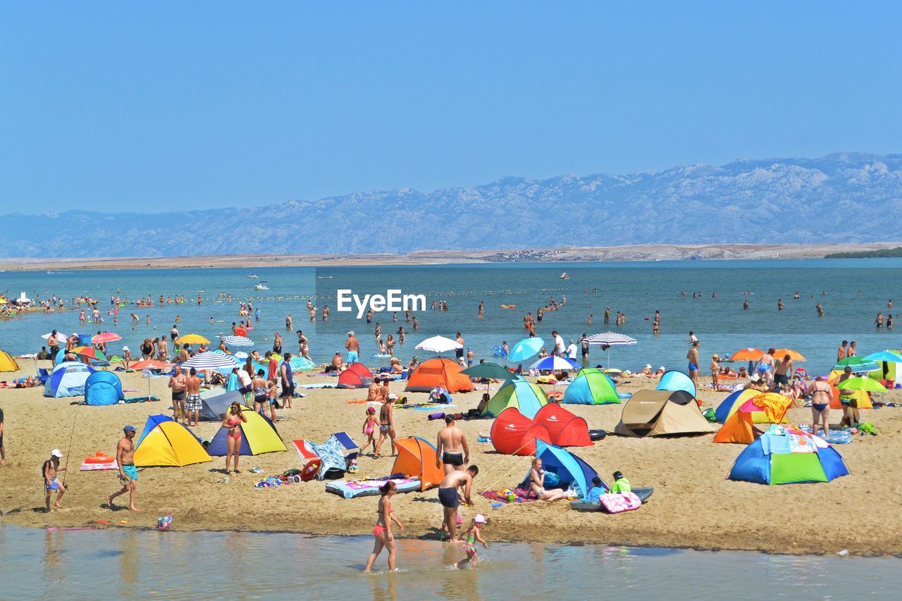 GROUP OF PEOPLE ON BEACH