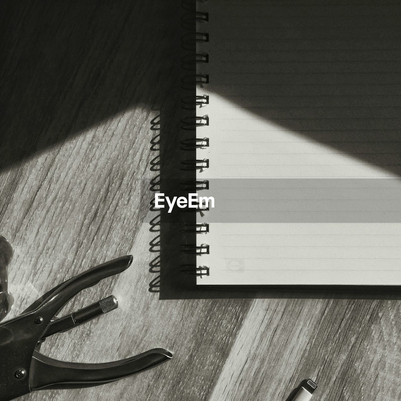 CLOSE-UP OF BOOK ON TABLE