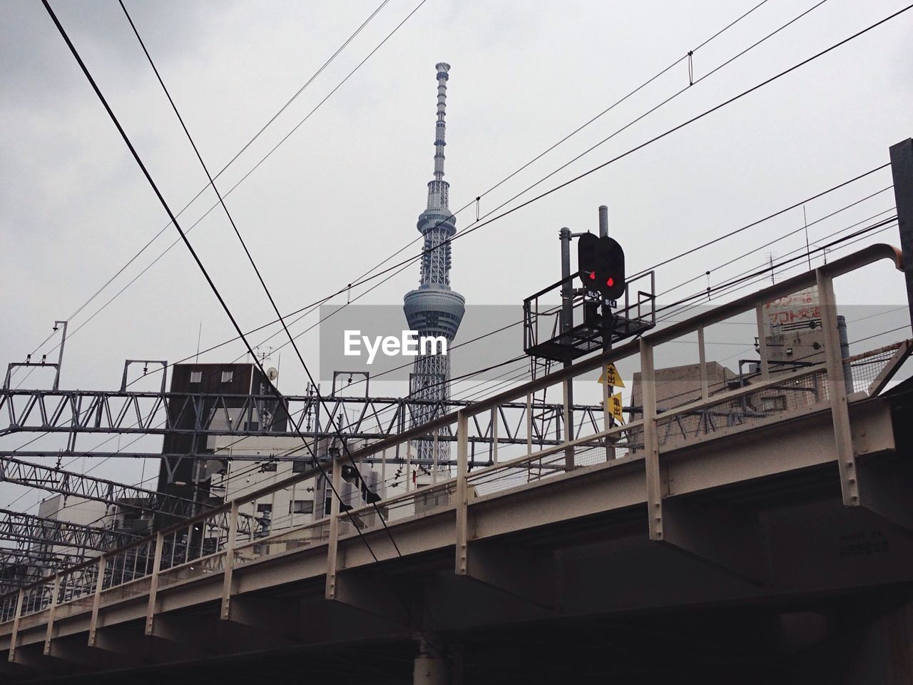 LOW ANGLE VIEW OF CONSTRUCTION CRANE AGAINST SKY