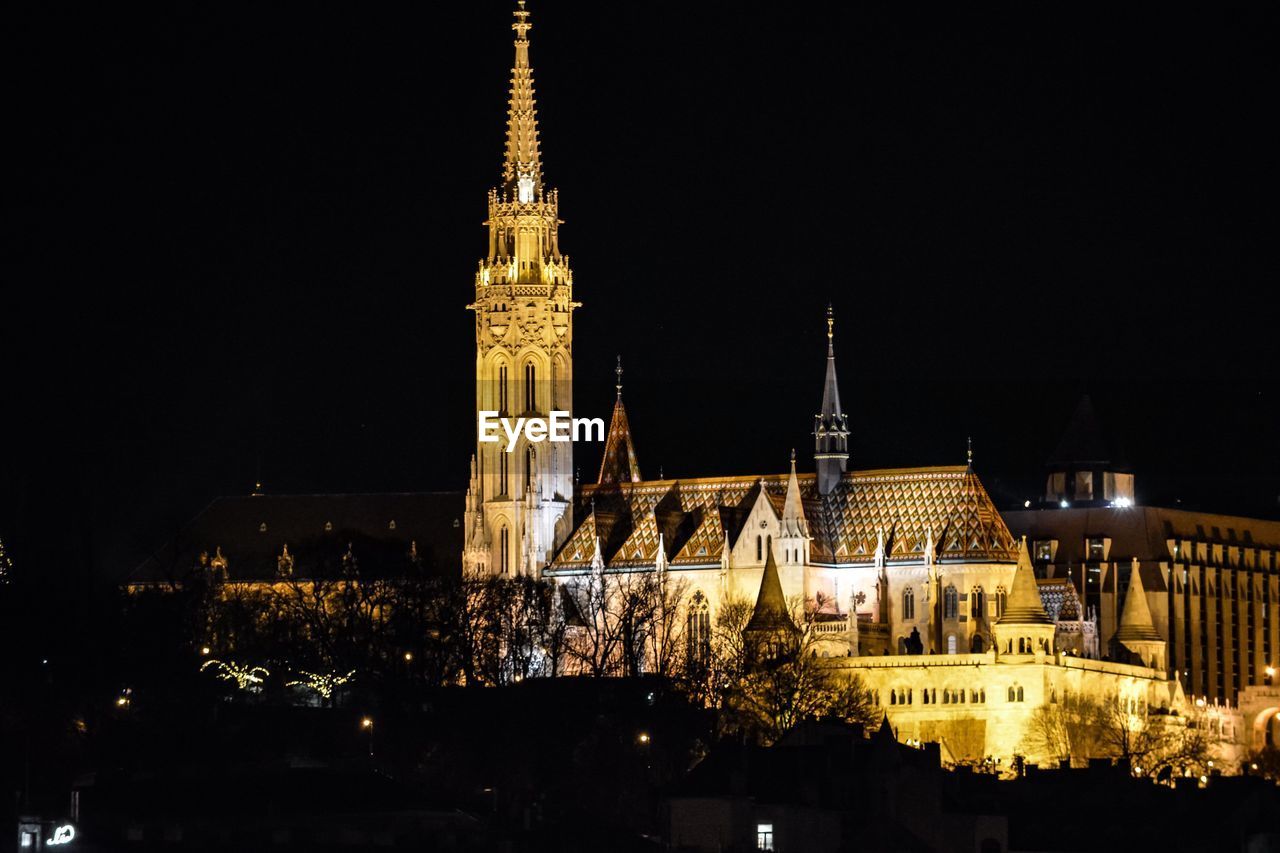 ILLUMINATED BUILDING AGAINST SKY AT NIGHT