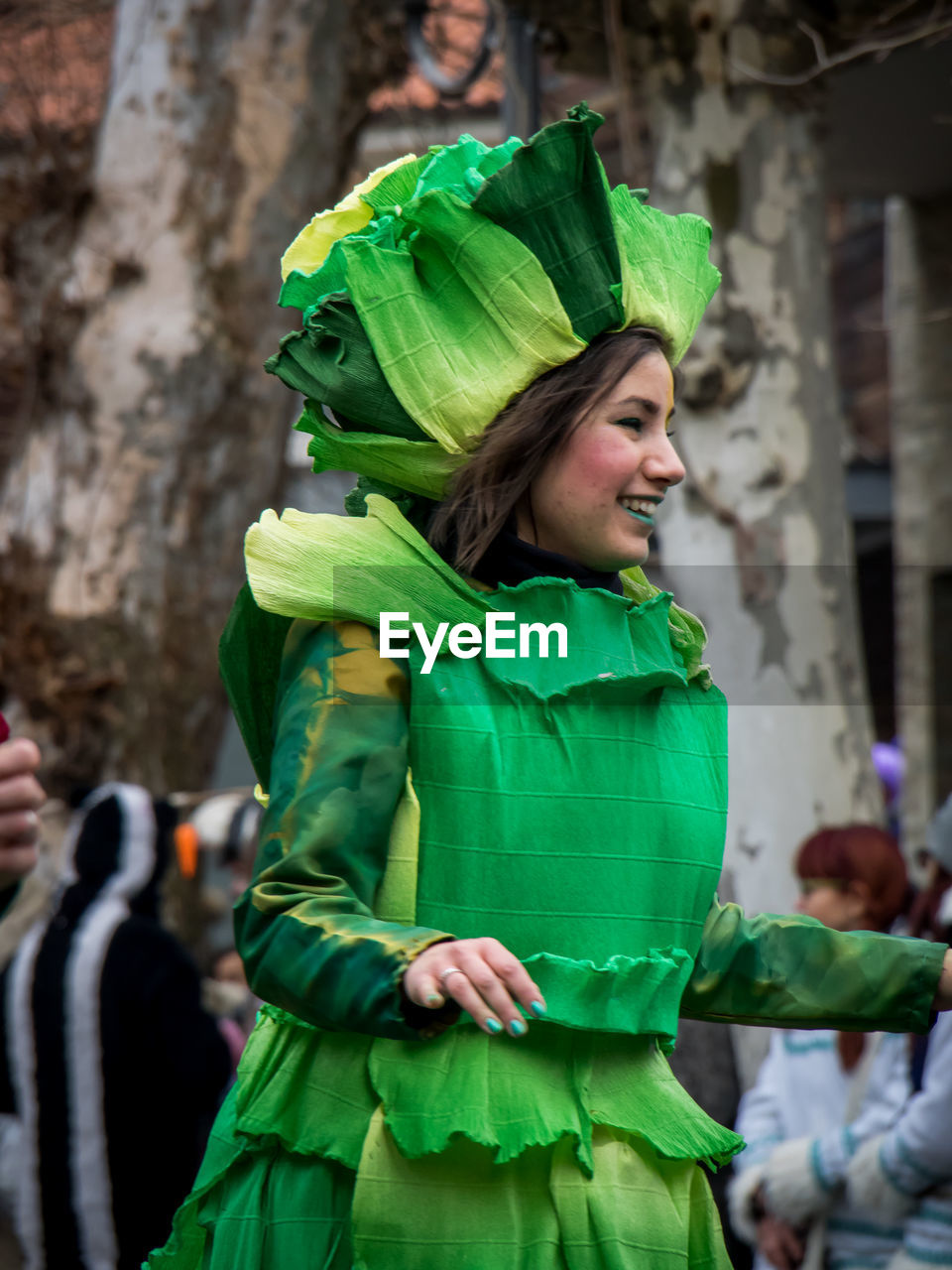 WOMAN STANDING ON LEAF