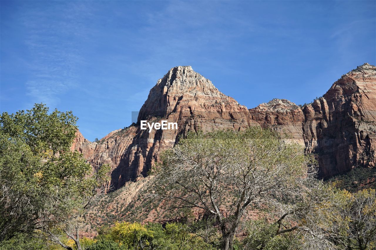 Low angle view of rock formations against sky