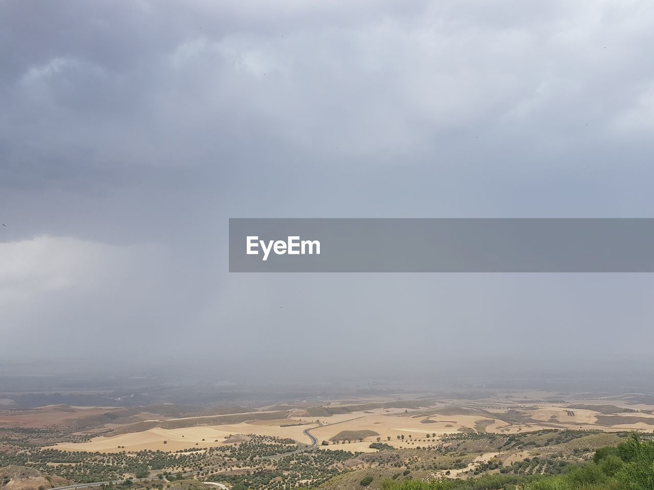 Aerial view of agricultural field against sky