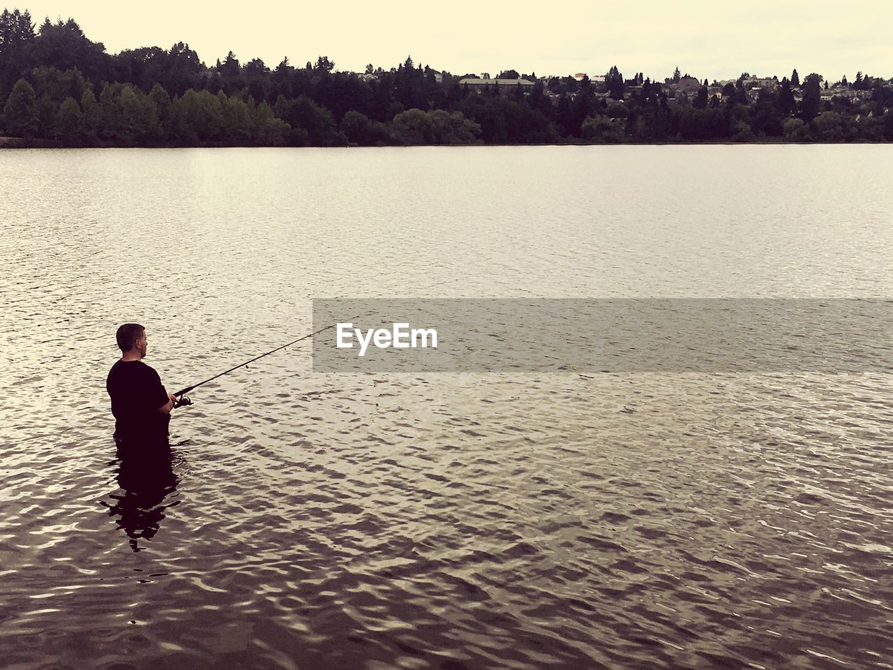 Man fishing in lake