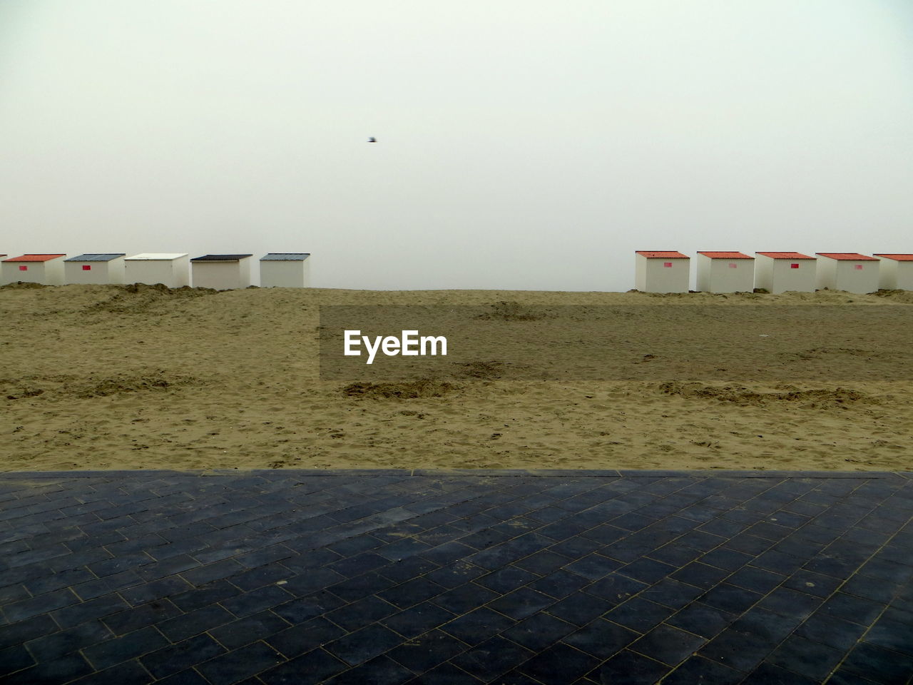 LIFEGUARD HUT ON BEACH AGAINST CLEAR SKY