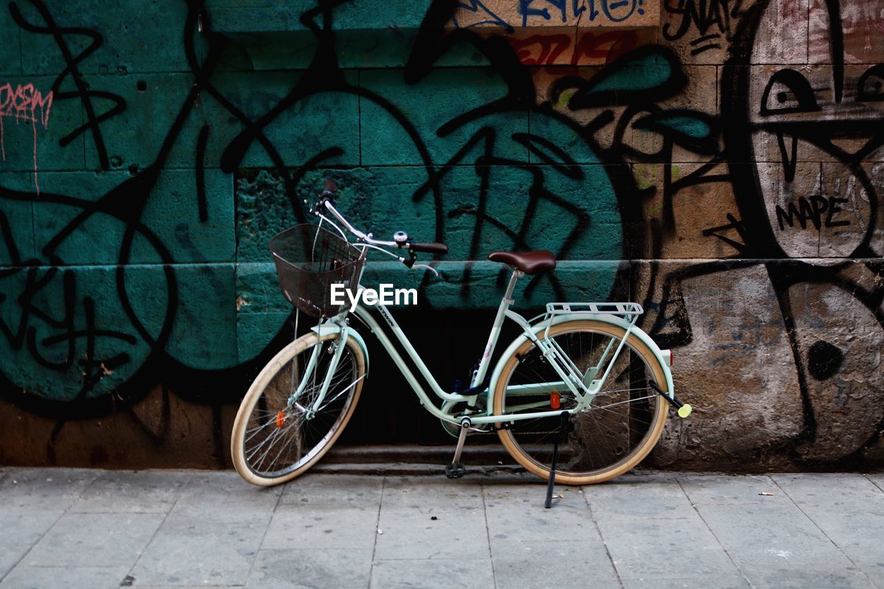 BICYCLE PARKED ON WALL