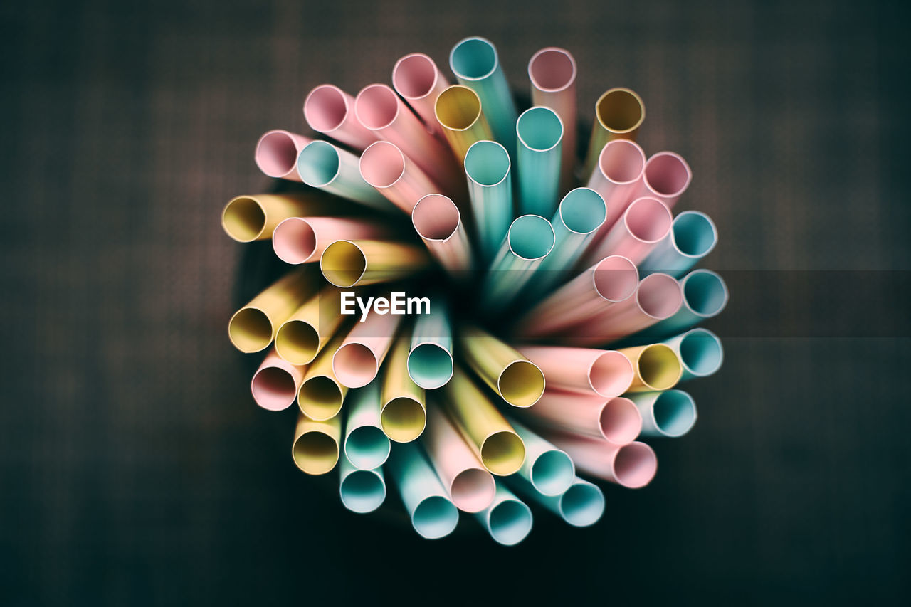 Close-up of colorful drinking straws on table