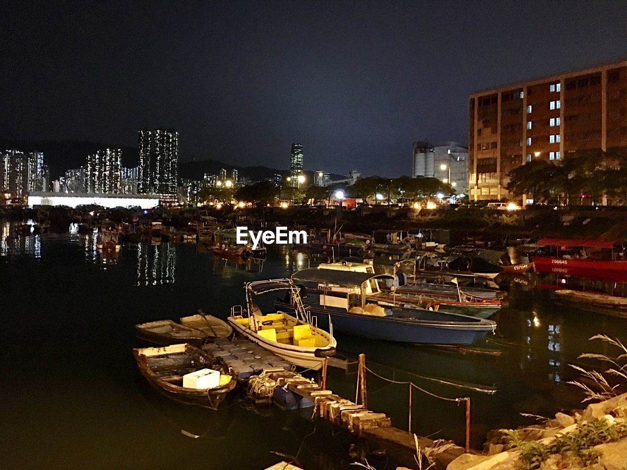 night, illuminated, nautical vessel, building exterior, boat, architecture, moored, built structure, water, transportation, mode of transport, outdoors, city, no people, harbor, river, sky, clear sky, cityscape, yacht, nature