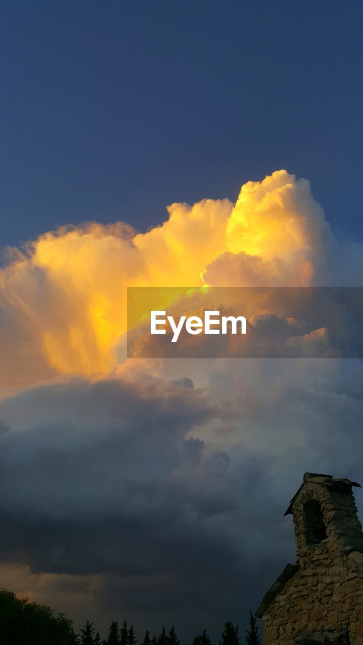 LOW ANGLE VIEW OF SKY OVER CLOUDS