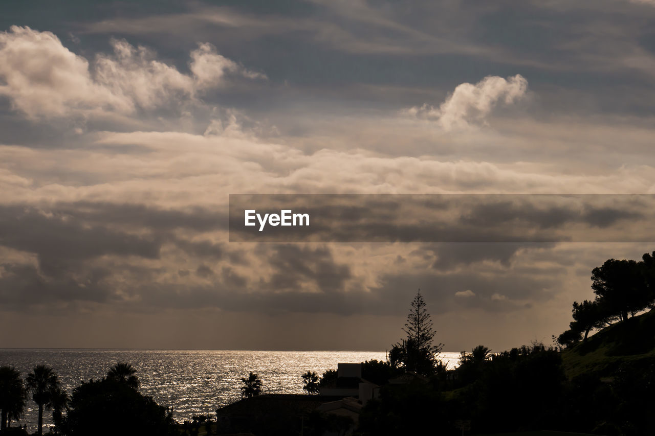 Scenic view of sea against sky at sunset