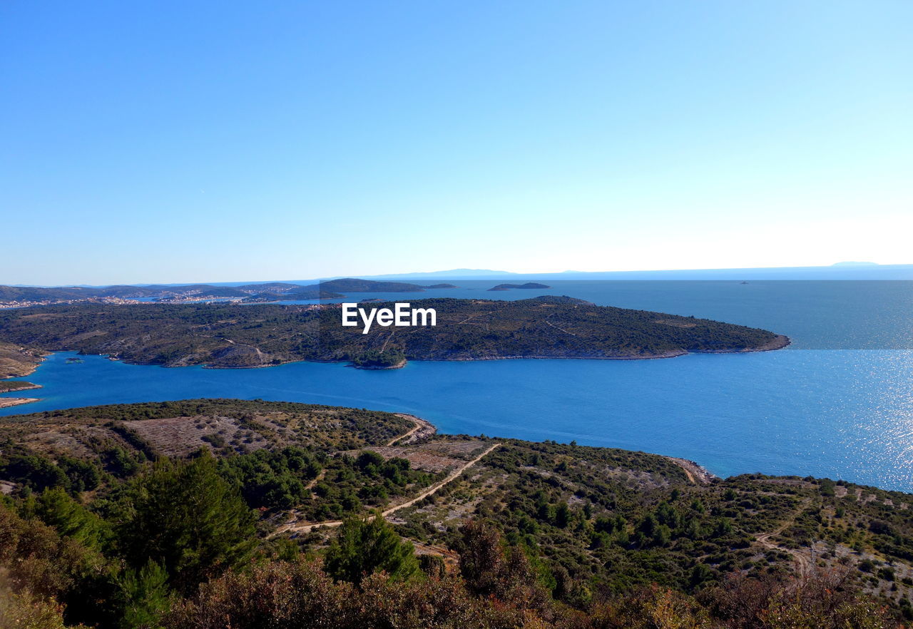 Scenic view of sea against clear blue sky