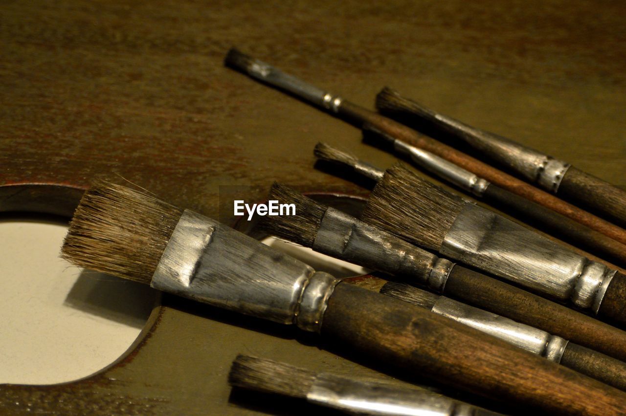 Close-up of paintbrushes on table