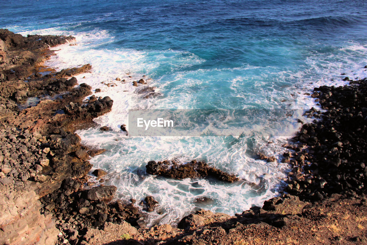 High angle view of rocky coastline