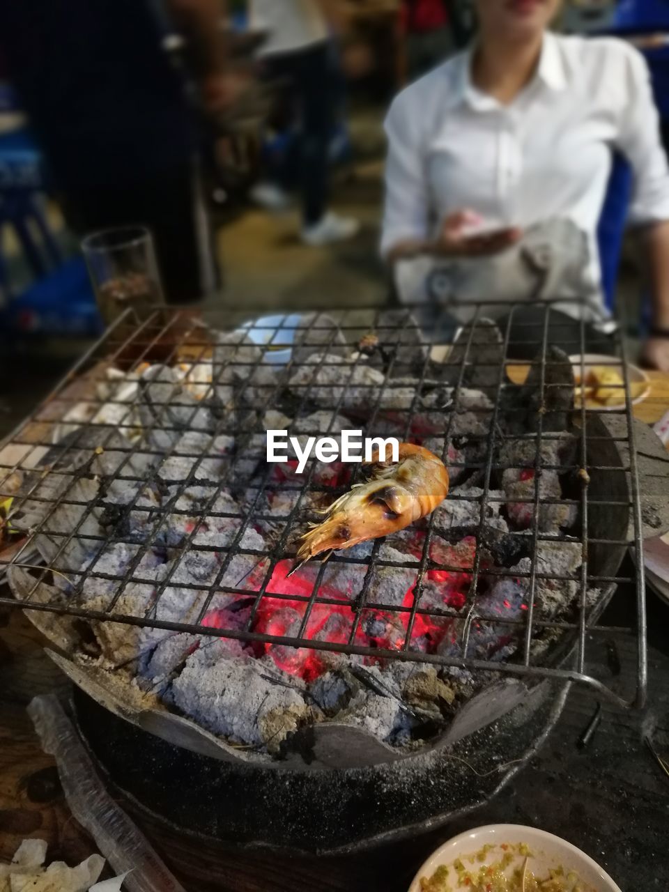 CLOSE-UP OF CHICKEN ON BARBECUE