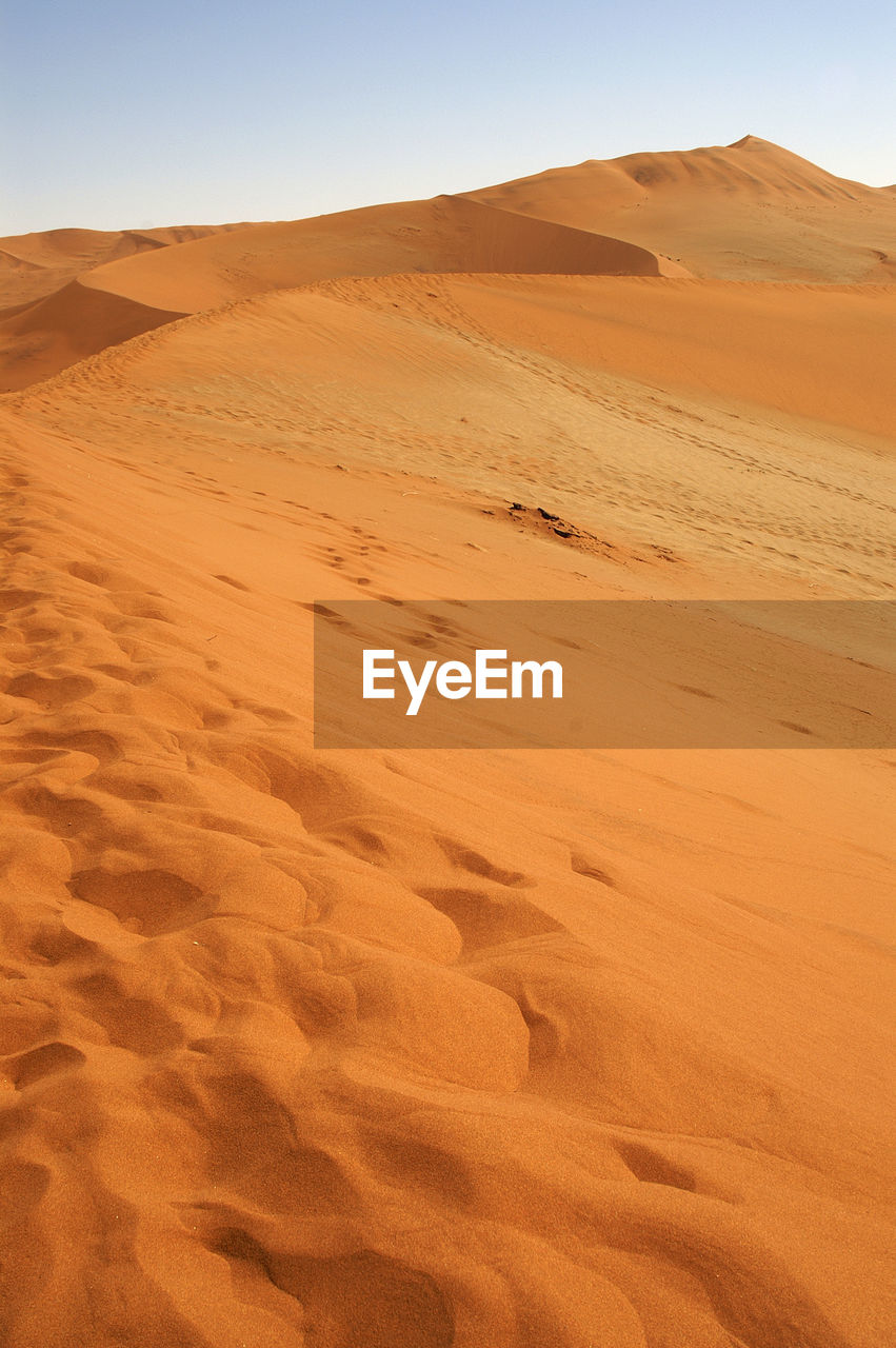 Scenic view of desert against clear sky