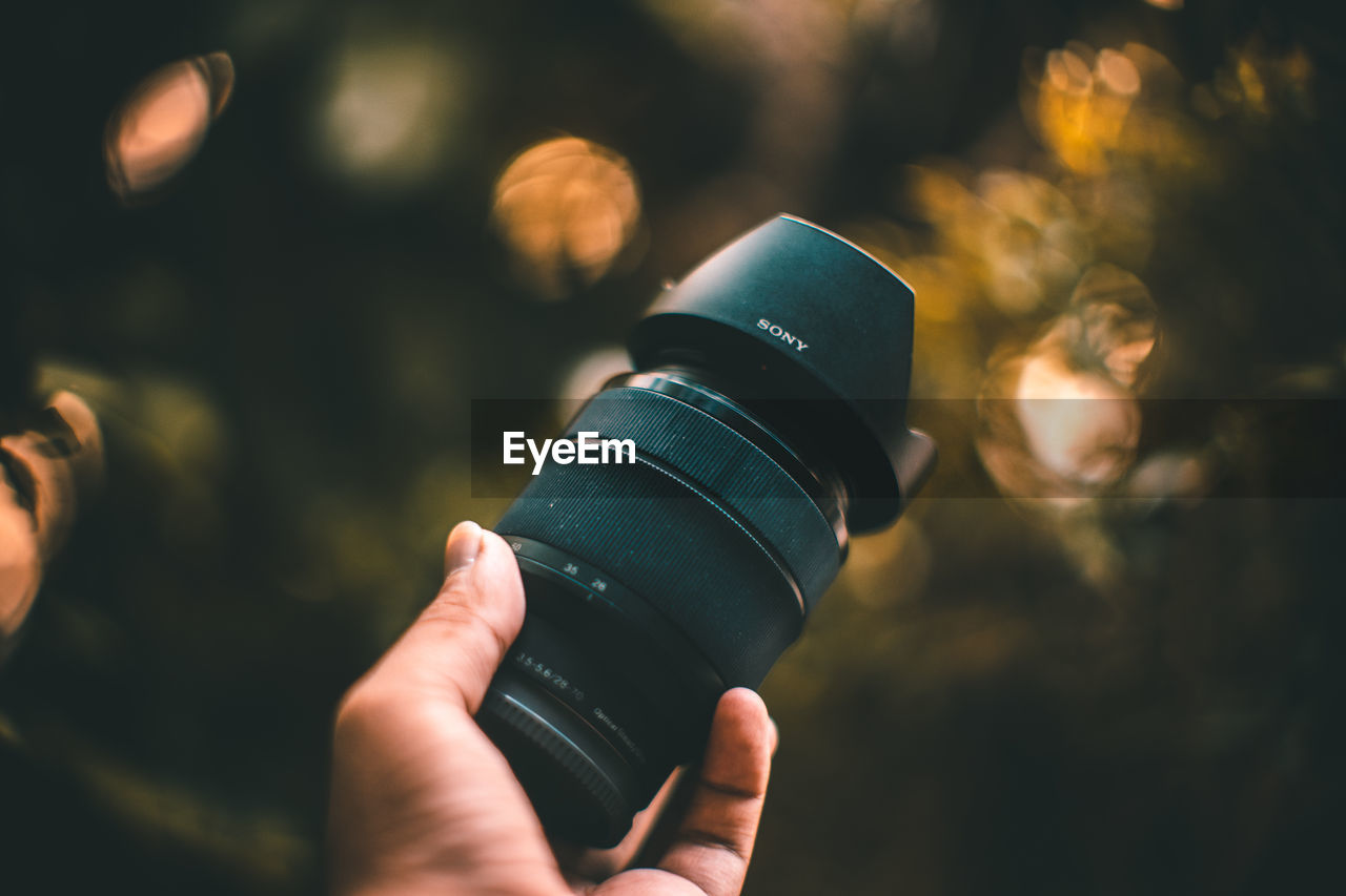 CLOSE-UP OF PERSON PHOTOGRAPHING