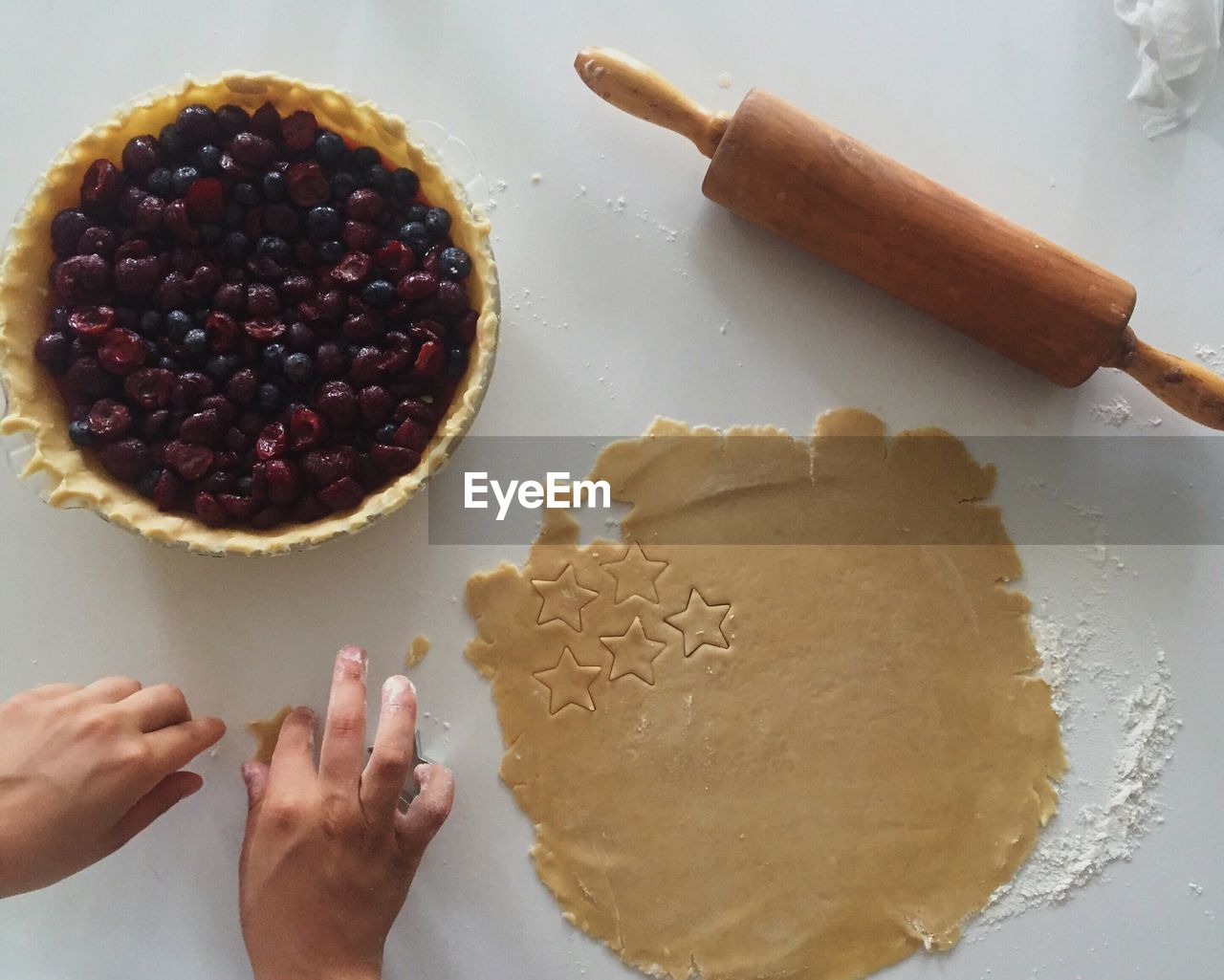 Cropped image of person making cookies