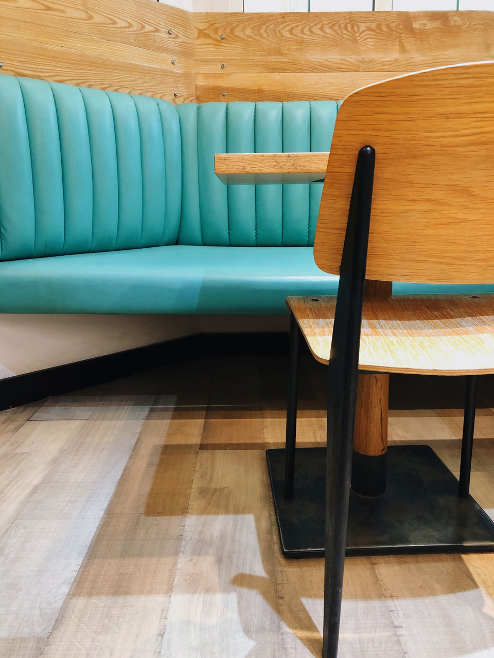 EMPTY CHAIRS AND TABLE IN ROOM