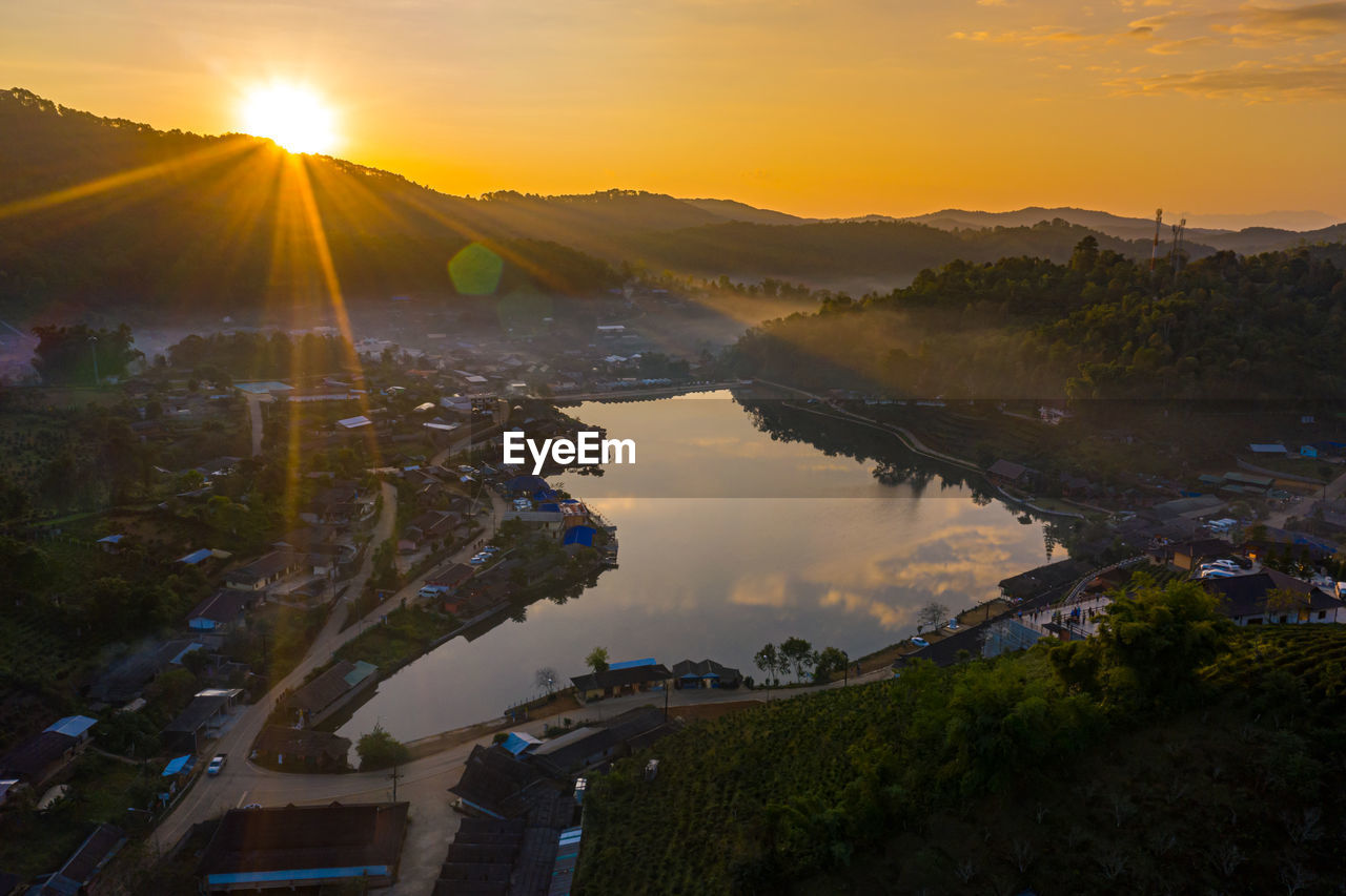 SCENIC VIEW OF SUNSET OVER CITY