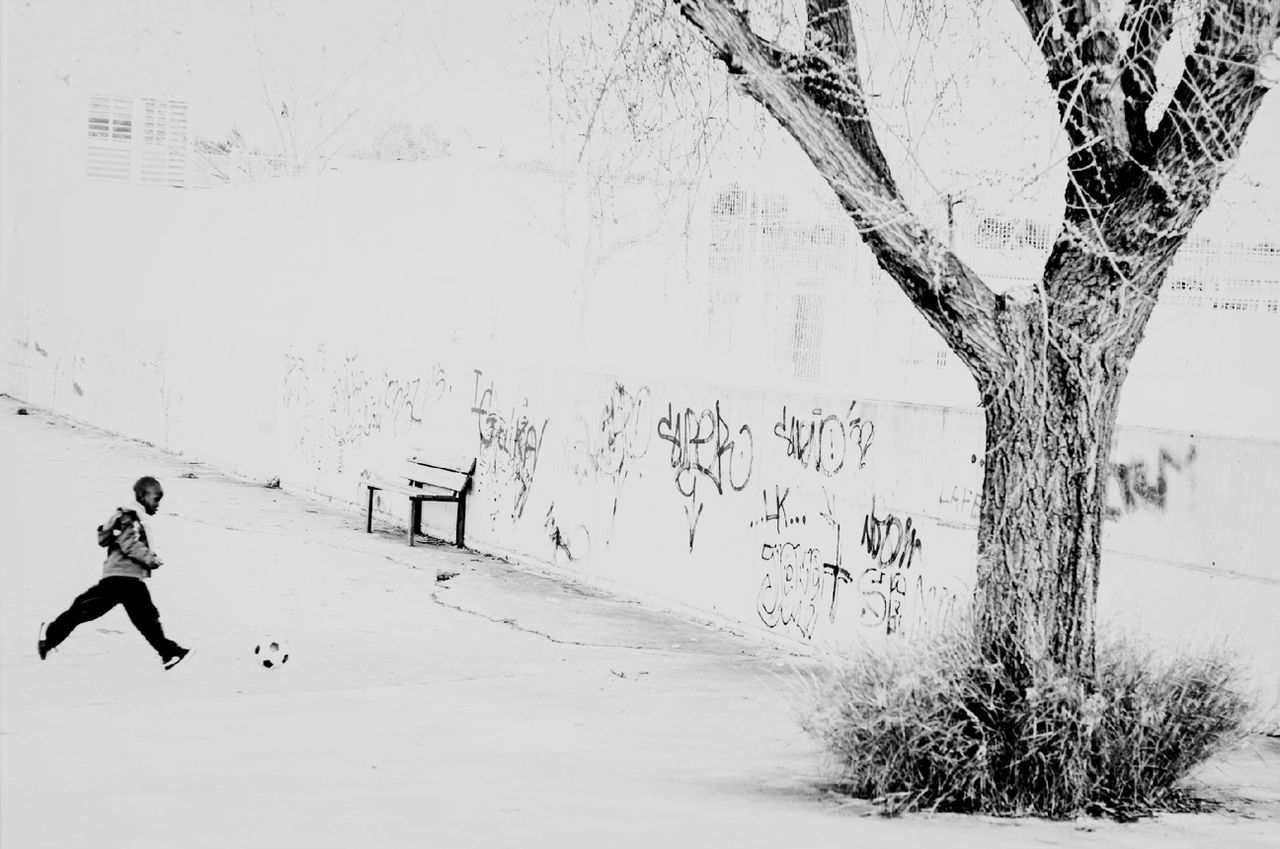 cold temperature, winter, snow, full length, real people, outdoors, one person, day, architecture, leisure activity, motion, nature, tree, built structure, sport, lifestyles, building exterior, bare tree, people