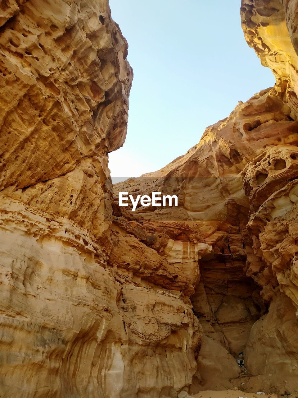 Low angle view of rock formation against sky